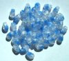 50 9mm Crystal & Light Sapphire Twisted Oval Crackle Beads